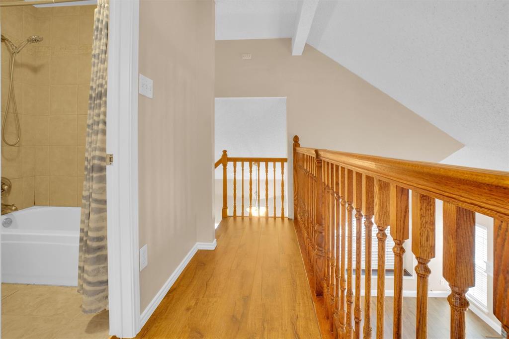 449 Harris Street, Unit I102 Coppell, TX 75019 - Photo 21 of 33 a view of a hallway with wooden floor