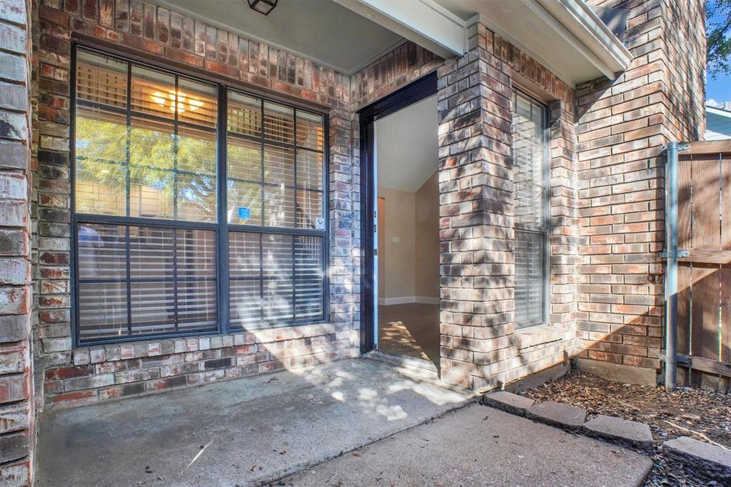 449 Harris Street, Unit I102 Coppell, TX 75019 - Photo 23 of 33 a brick building with a window and a door