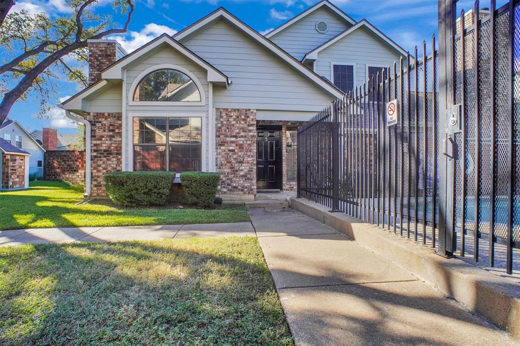 449 Harris Street, Unit I102 Coppell, TX 75019 - Photo 31 of 33 a front view of a house with yard and green space