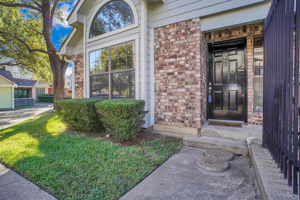 449 Harris Street, Unit I102 Coppell, TX 75019 - Photo 32 of 33 a view of a house with a small yard and a large window