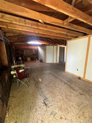 a view of an empty room with wooden frame