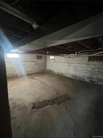 a view of dirt yard with a large tree