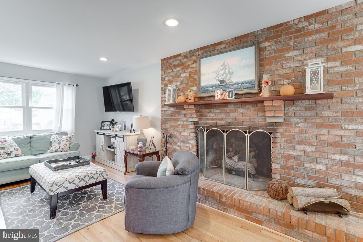 511 Cheddington Road Linthicum, MD 21090 - Photo 9 of 39 Full wall brick hearth gas fireplace
