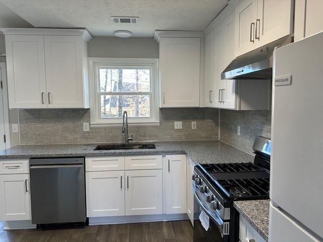 455 Rill Crest Court Alpharetta, GA 30022 - Photo 4 of 13 a kitchen with granite countertop white cabinets and appliances