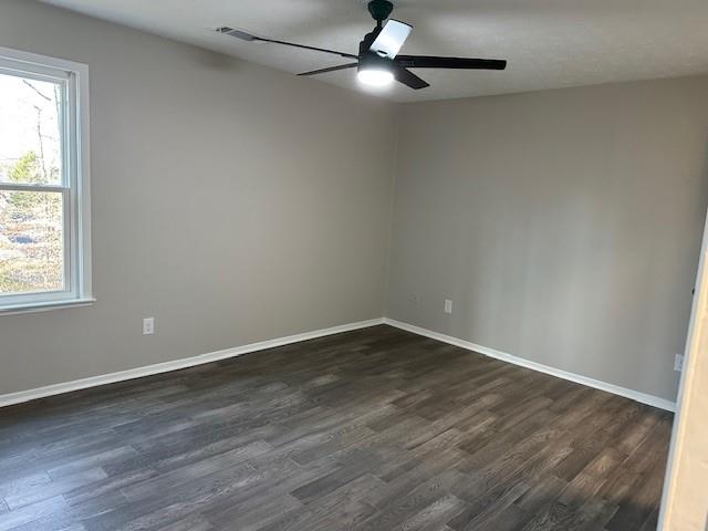 455 Rill Crest Court Alpharetta, GA 30022 - Photo 9 of 13 a view of an empty room with wooden floor and a window