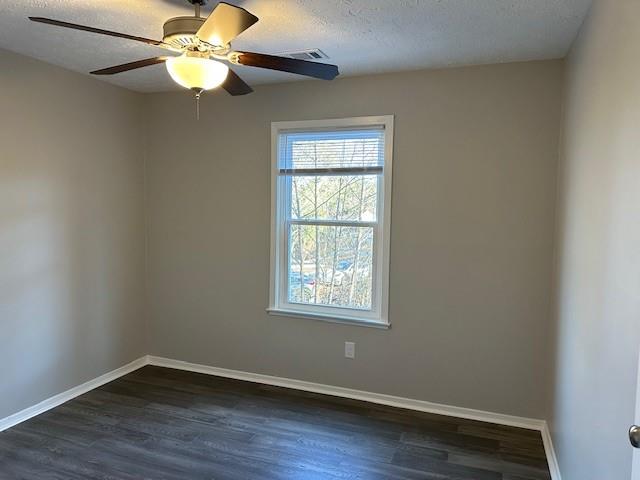 455 Rill Crest Court Alpharetta, GA 30022 - Photo 10 of 13 an empty room with wooden floor fan and windows