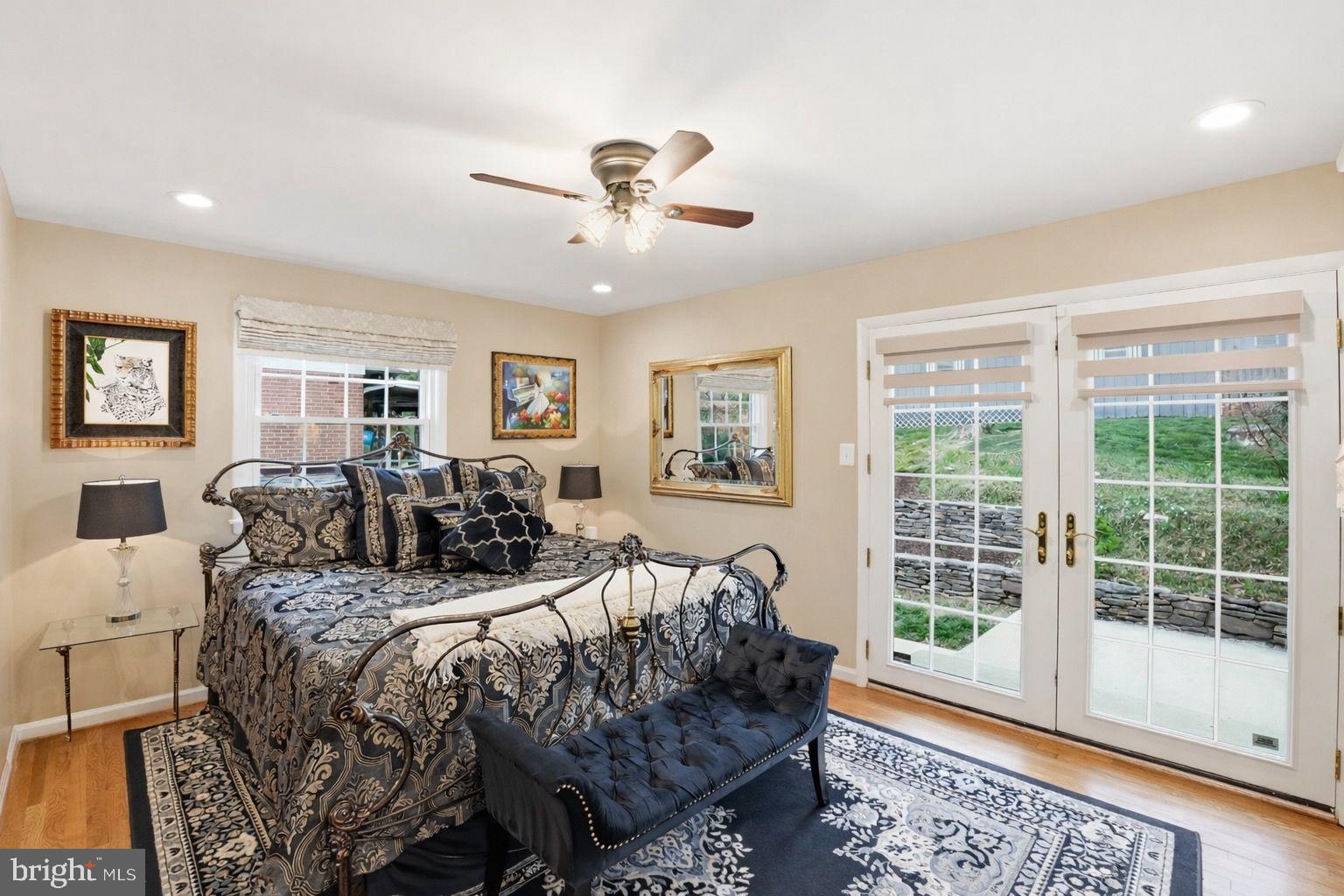 1821 Briggs Road Silver Spring, MD 20906 - Photo 11 of 23 a large bedroom with a large bed and a window