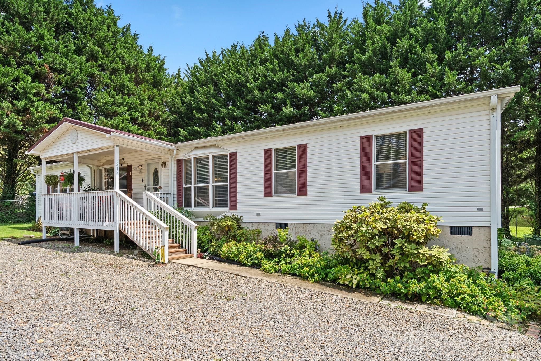 213 Old State 10 Road Black Mountain, NC 28711 - Photo 1 of 44 a view of house with a yard and sitting area