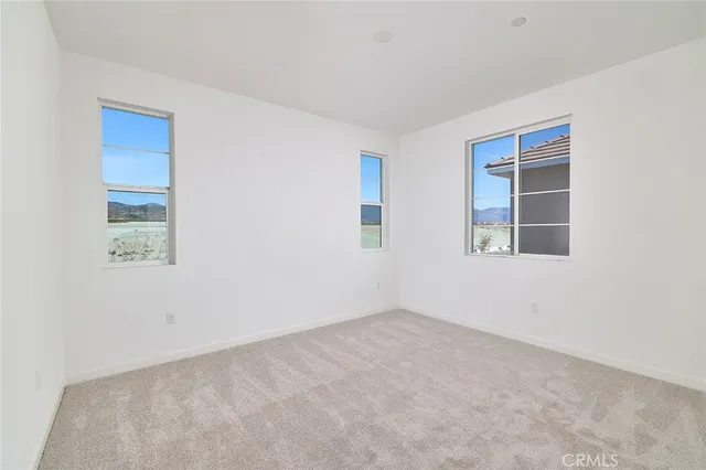 a bathroom with a sink a toilet and a large mirror