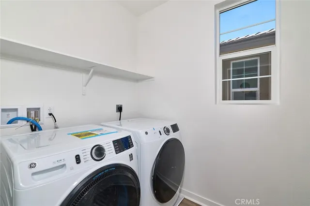a view of a house with swimming pool and a yard