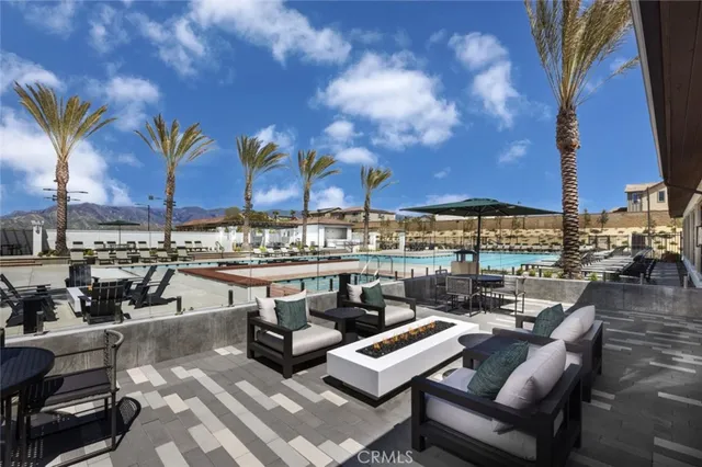 a living room with furniture and ceiling fan