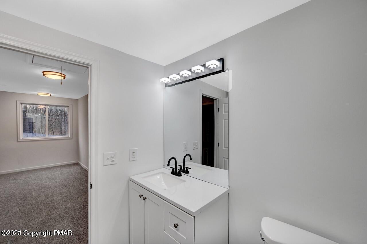 113 Java Hill East Stroudsburg, PA 18302 - Photo 15 of 36 a bathroom with a sink toilet and mirror