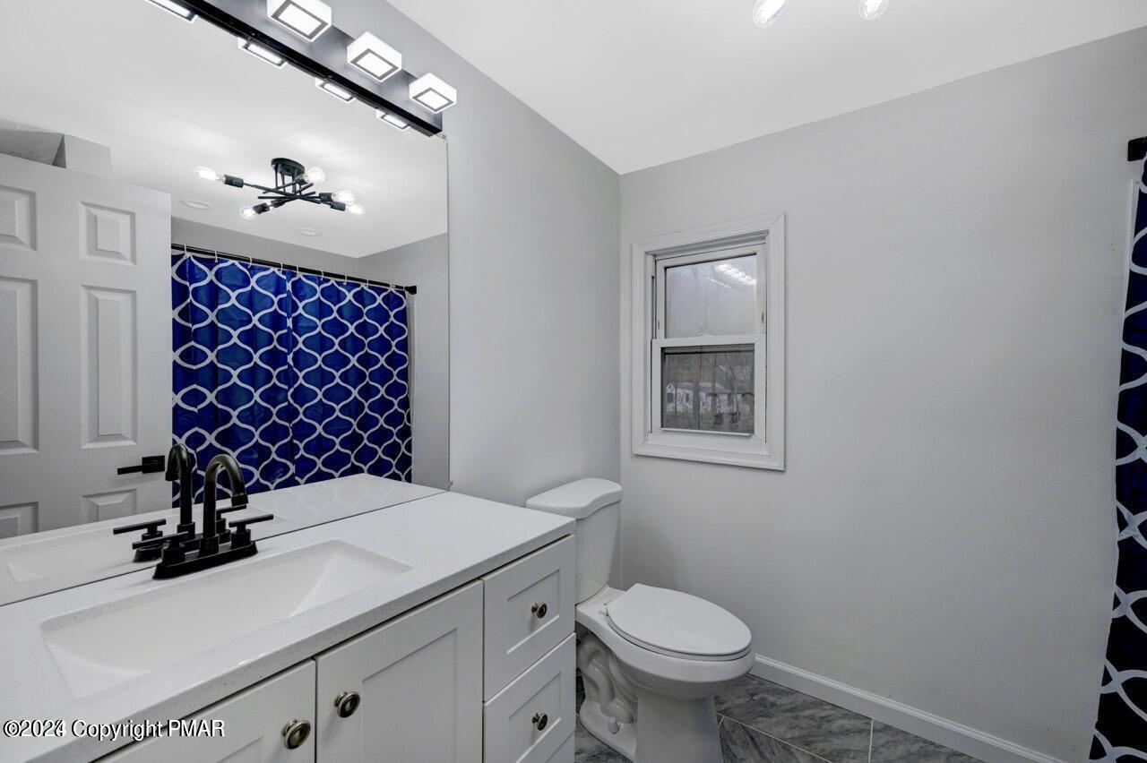 113 Java Hill East Stroudsburg, PA 18302 - Photo 16 of 36 a bathroom with a sink toilet and a mirror