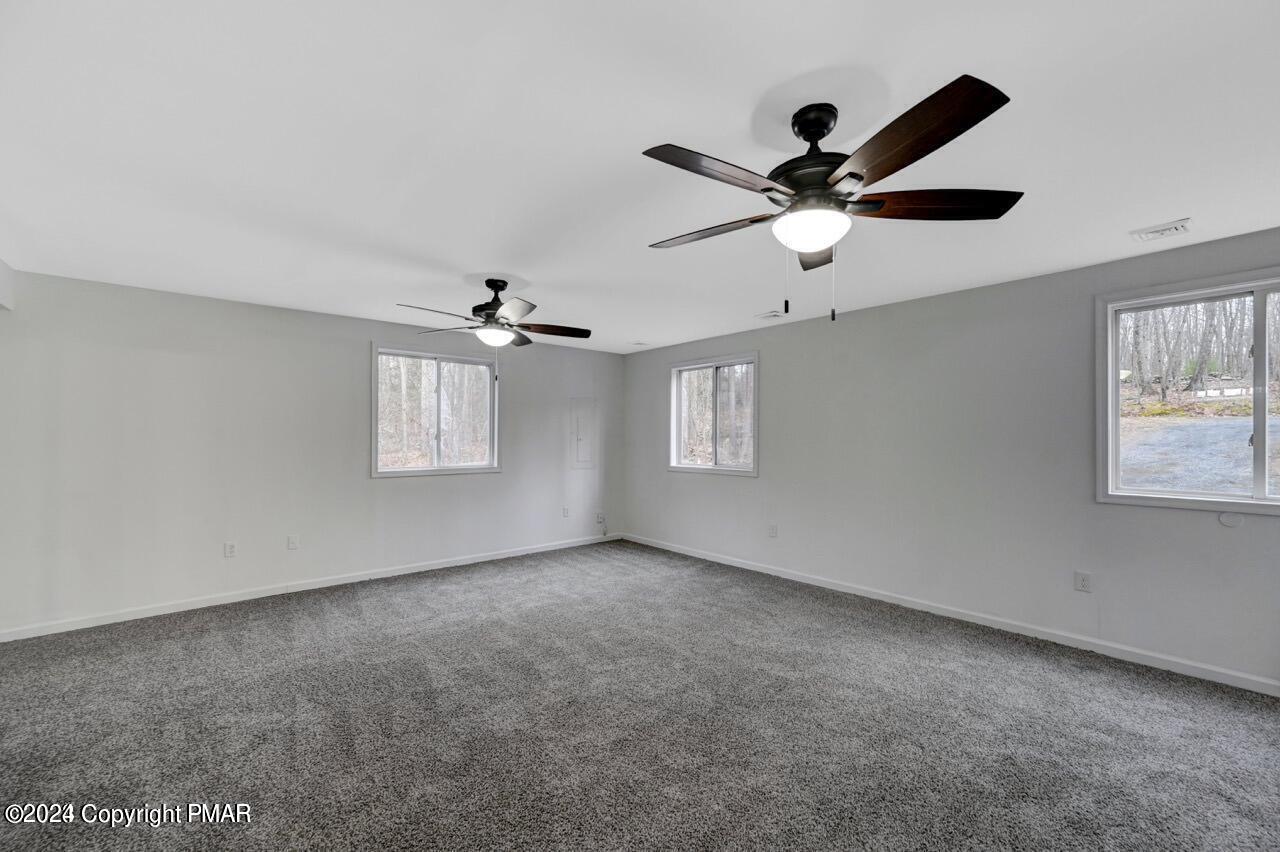 113 Java Hill East Stroudsburg, PA 18302 - Photo 19 of 36 a view of empty room with window and ceiling fan