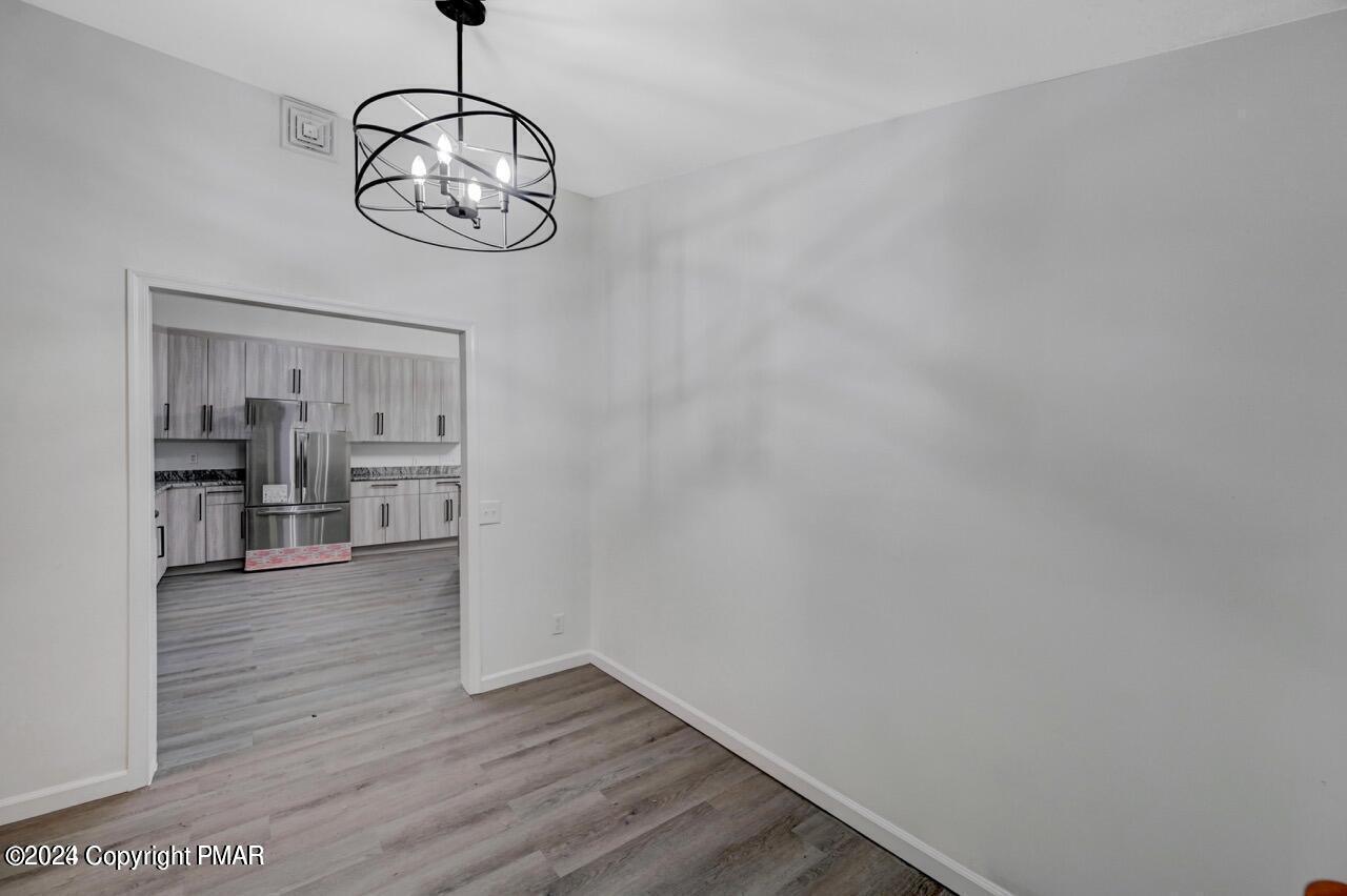 113 Java Hill East Stroudsburg, PA 18302 - Photo 29 of 36 a view of a room with wooden floor and kitchen view