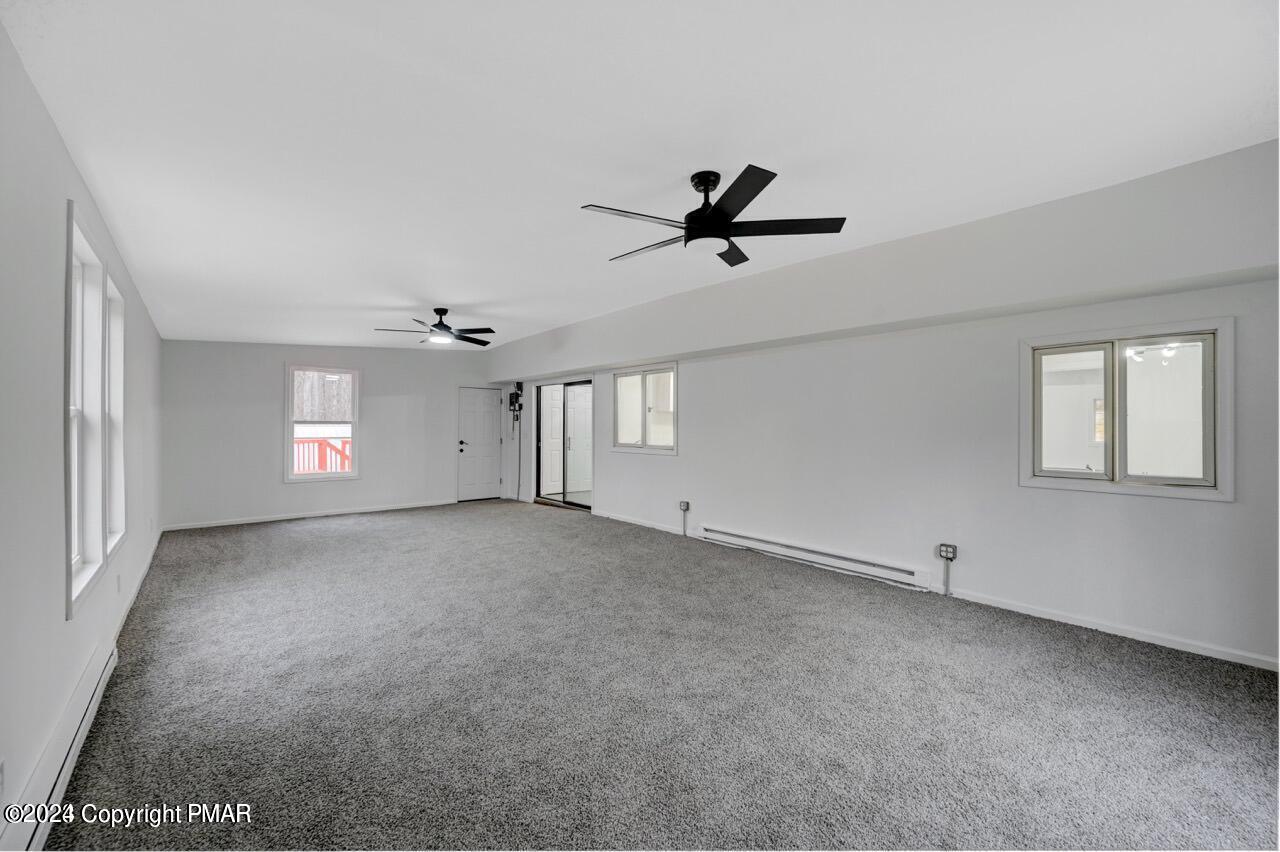 113 Java Hill East Stroudsburg, PA 18302 - Photo 31 of 36 a view of a livingroom with a ceiling fan and window