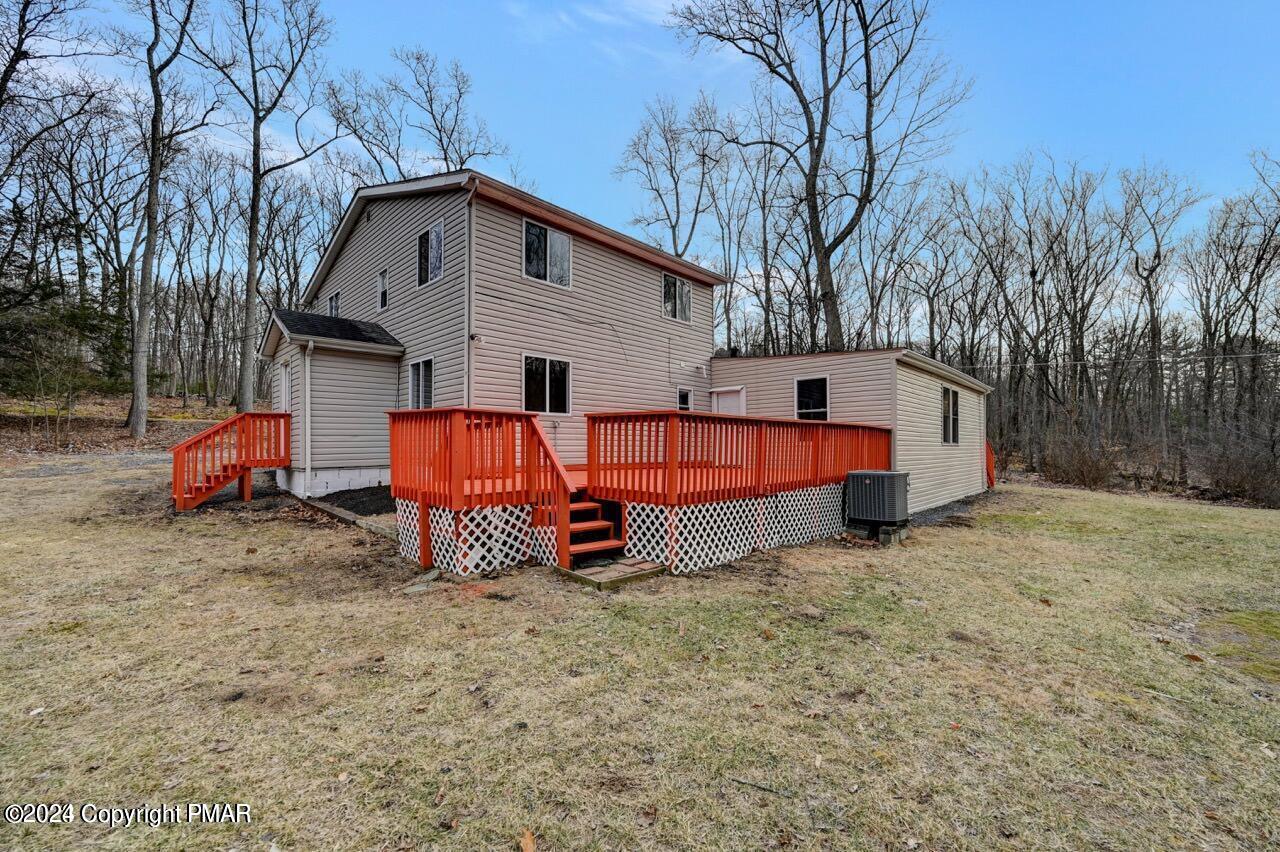 113 Java Hill East Stroudsburg, PA 18302 - Photo 34 of 36 a view of backyard with large trees and wooden fence