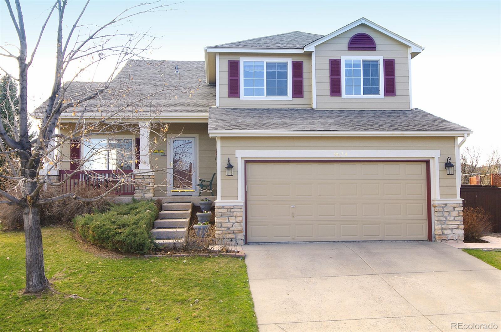 9674 Merimbula Street Highlands Ranch, CO 80130 - Photo 1 of 1 a front view of a house with a yard and garage