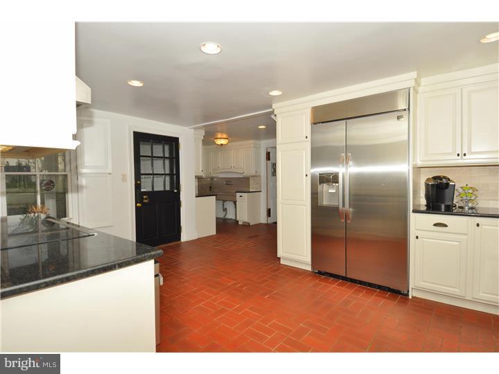1680 Boot Road West Chester, PA 19380 - Photo 11 of 25 a kitchen with stainless steel appliances kitchen island granite countertop a refrigerator a stove and a sink