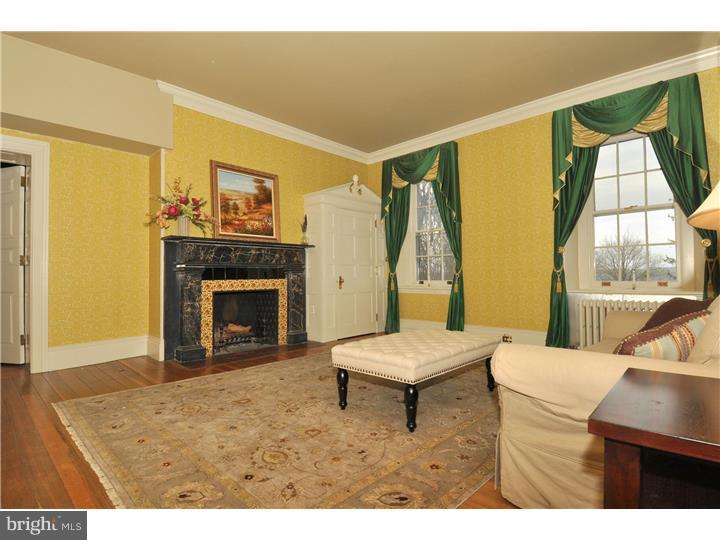 1680 Boot Road West Chester, PA 19380 - Photo 18 of 25 a living room with a table and a fireplace