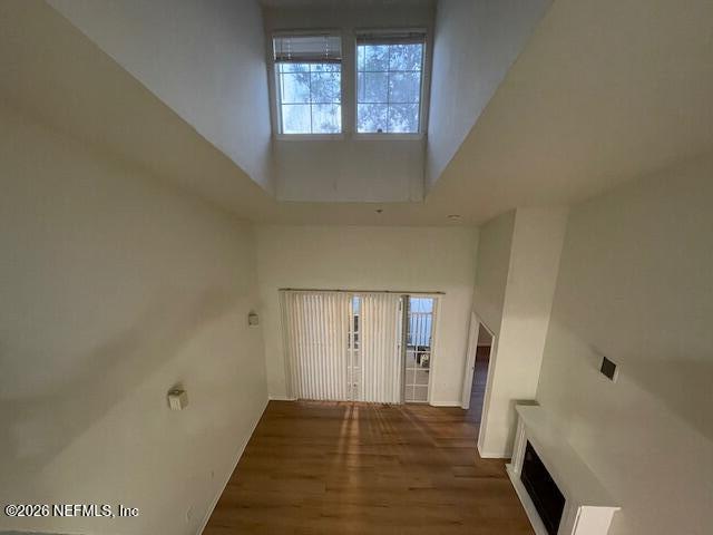 8550 Touchton Road, Unit 1436 Jacksonville, FL 32216 - Photo 26 of 37 a view of an empty room with wooden floor and a window