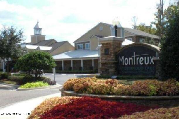 8550 Touchton Road, Unit 1436 Jacksonville, FL 32216 - Photo 30 of 37 a view of a house with a yard