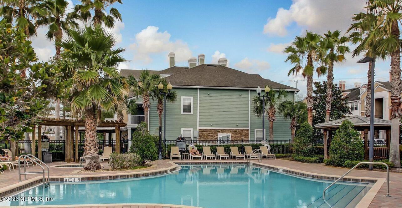 8550 Touchton Road, Unit 1436 Jacksonville, FL 32216 - Photo 31 of 37 a house view with garden space and sitting area