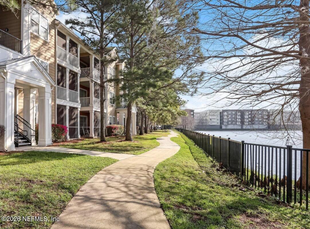 8550 Touchton Road, Unit 1436 Jacksonville, FL 32216 - Photo 34 of 37 a view of a building with a yard