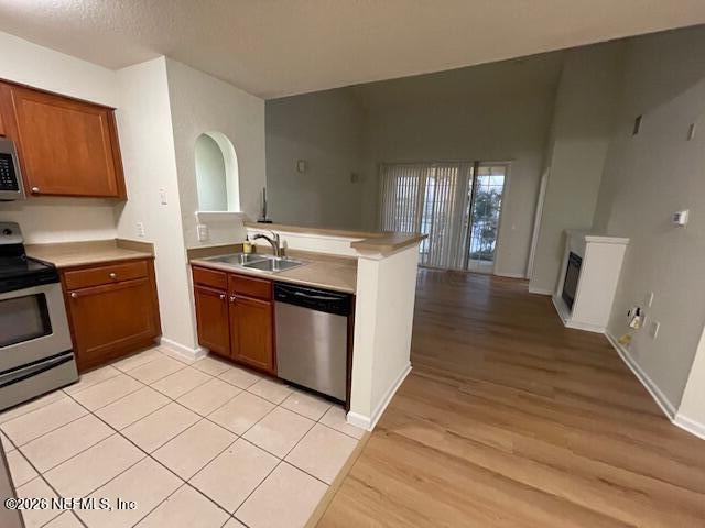 8550 Touchton Road, Unit 1436 Jacksonville, FL 32216 - Photo 6 of 37 a kitchen with stainless steel appliances a stove a sink and a refrigerator