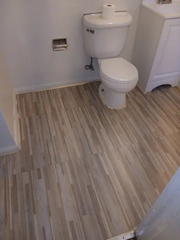 a bathroom with a toilet and a sink