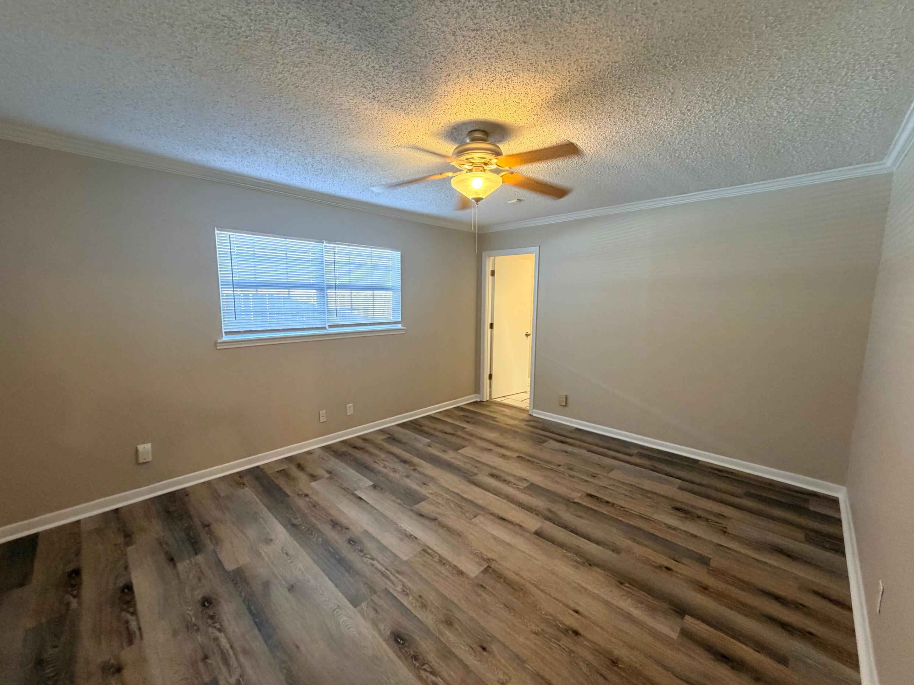4310 42nd Street Lubbock, TX 79413 - Photo 17 of 25 a view of an empty room with a window