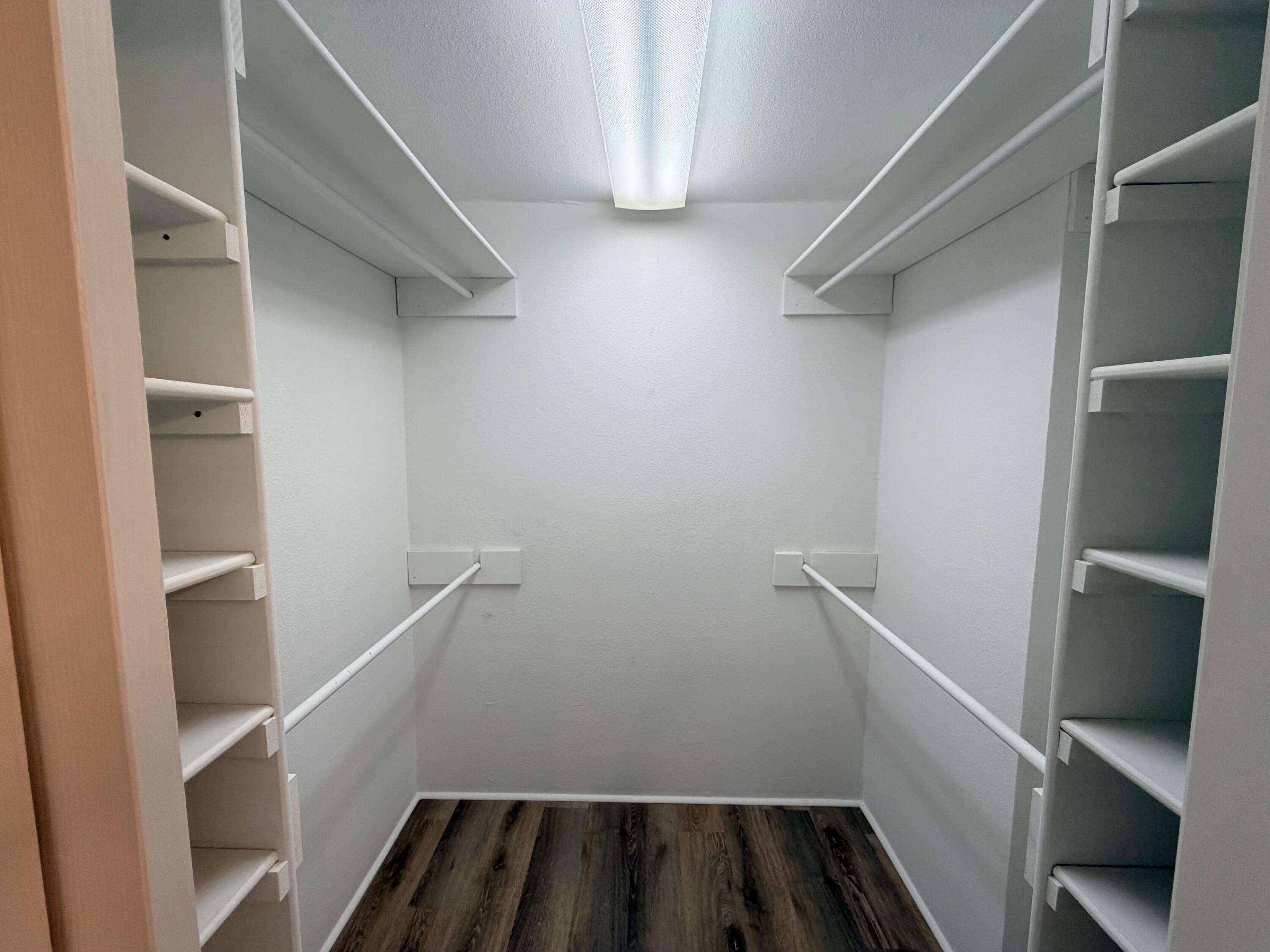 4310 42nd Street Lubbock, TX 79413 - Photo 19 of 25 a view of storage and utility room with racks on the wall