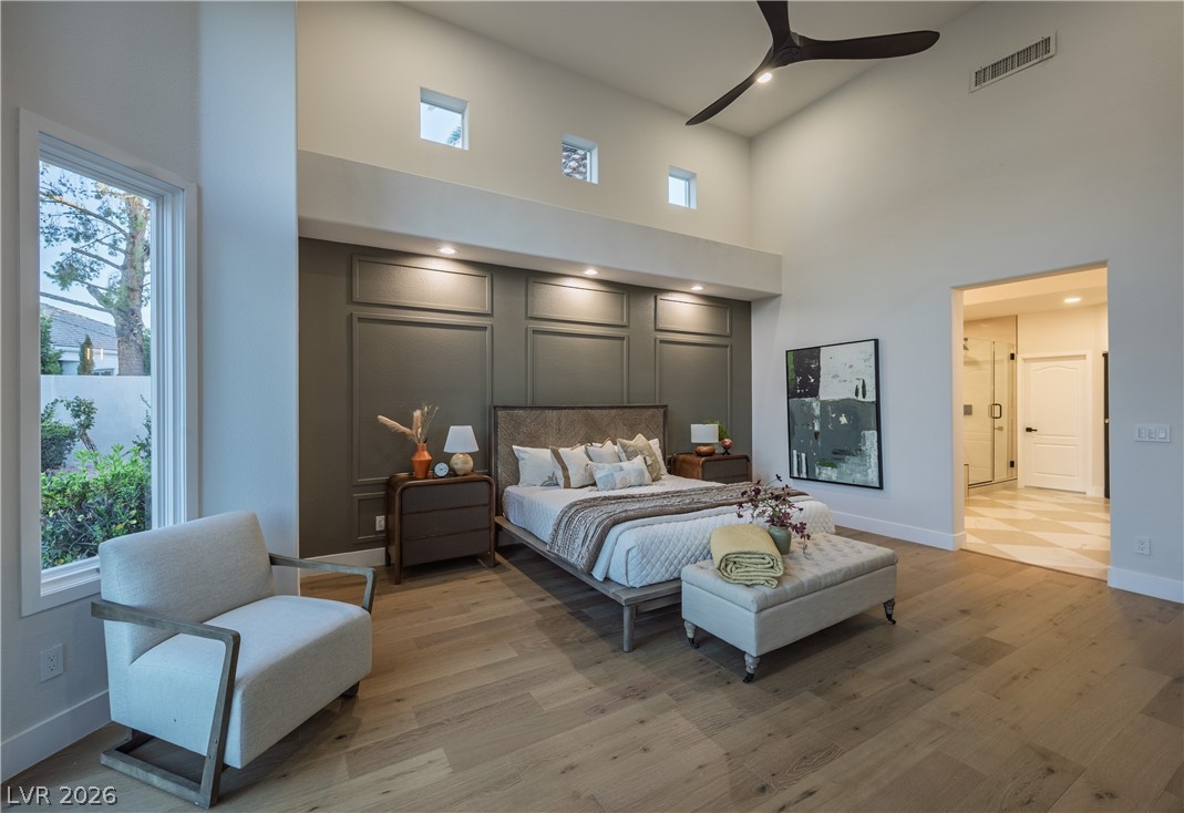 8800 Lusso Las Vegas, NV 89134 - Photo 41 of 85 Bedroom featuring a high ceiling, light wood-type flooring, ceiling fan, and recessed lighting