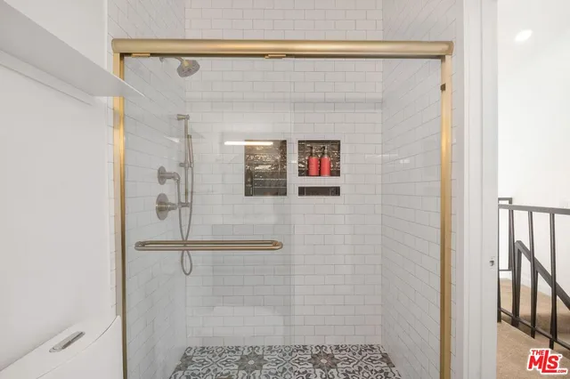 a bathroom with a shower and a sink
