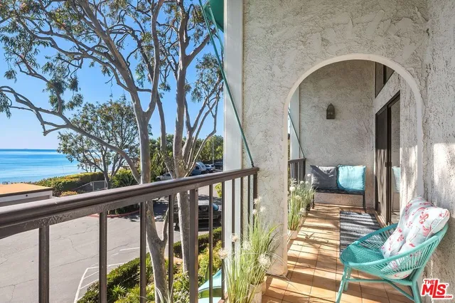 a view of balcony with furniture