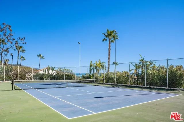 a view of balcony with wooden floor and a floor to ceiling window
