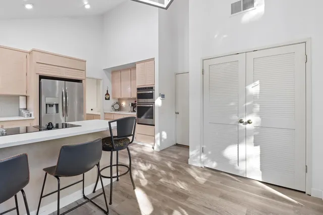 a kitchen with a table and chairs