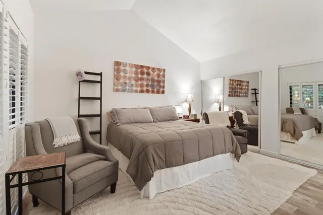 a bedroom with a bed and a couch