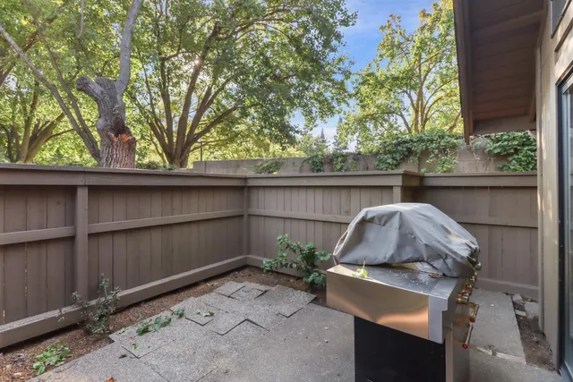 a backyard of a house with outdoor seating
