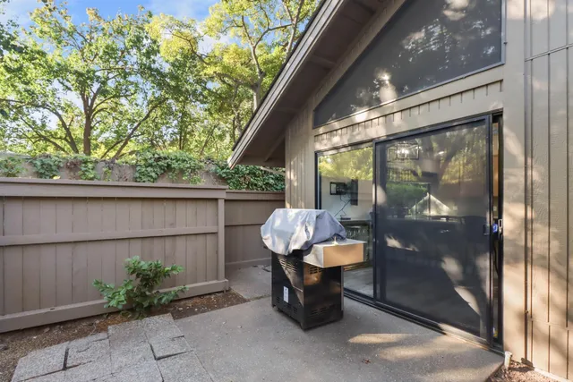 a outdoor living space with patio furniture and potted plants