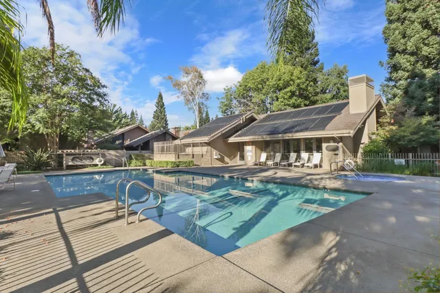 a view of a house with backyard