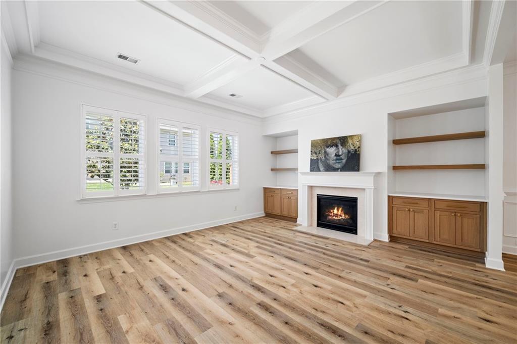 3628 Ashcroft Bend Atlanta, GA 30319 - Photo 17 of 44 wooden floor fireplace and windows in an empty room