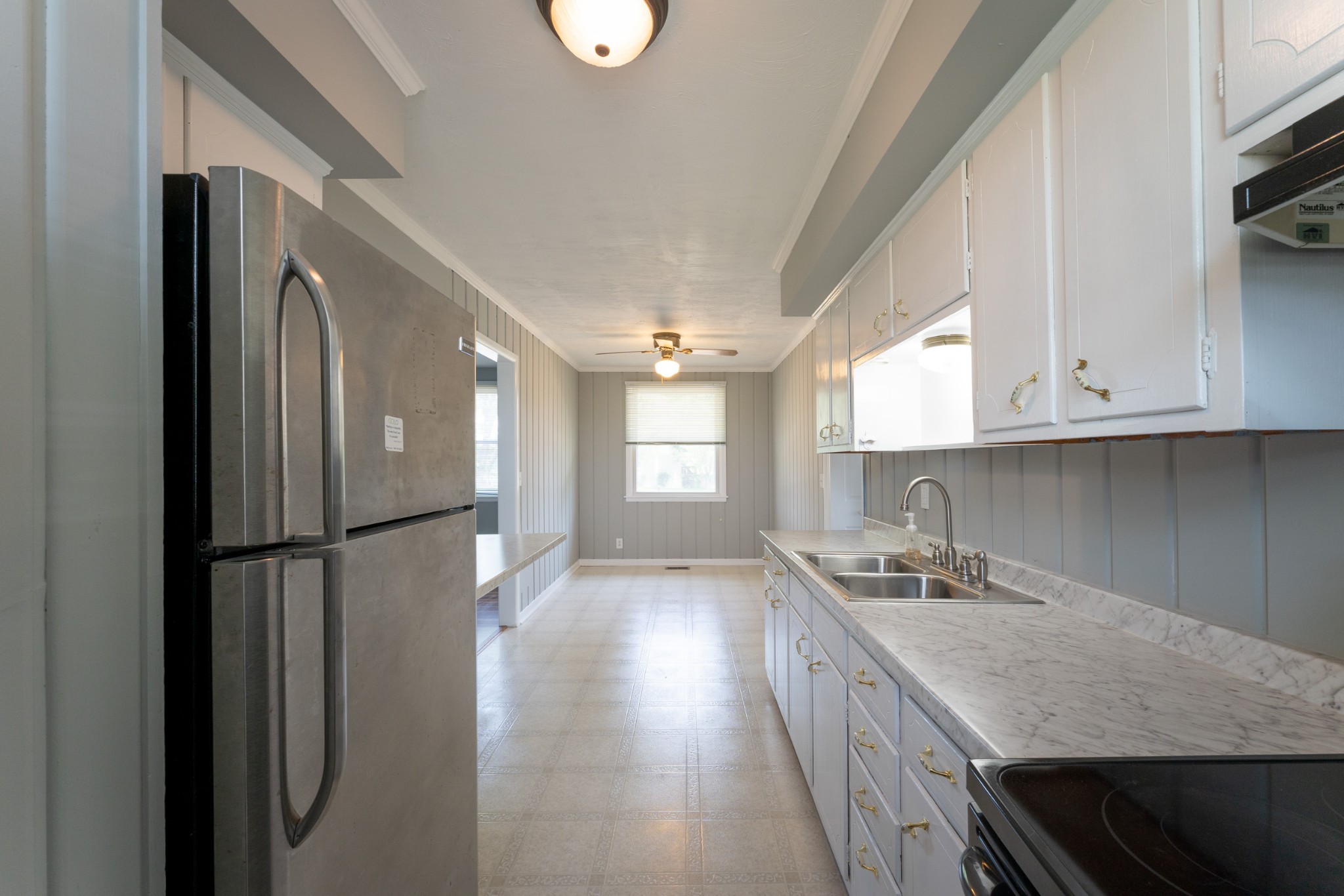 178 Jacksonian Drive Hermitage, TN 37076 - Photo 11 of 38 a kitchen with a refrigerator a sink and cabinets