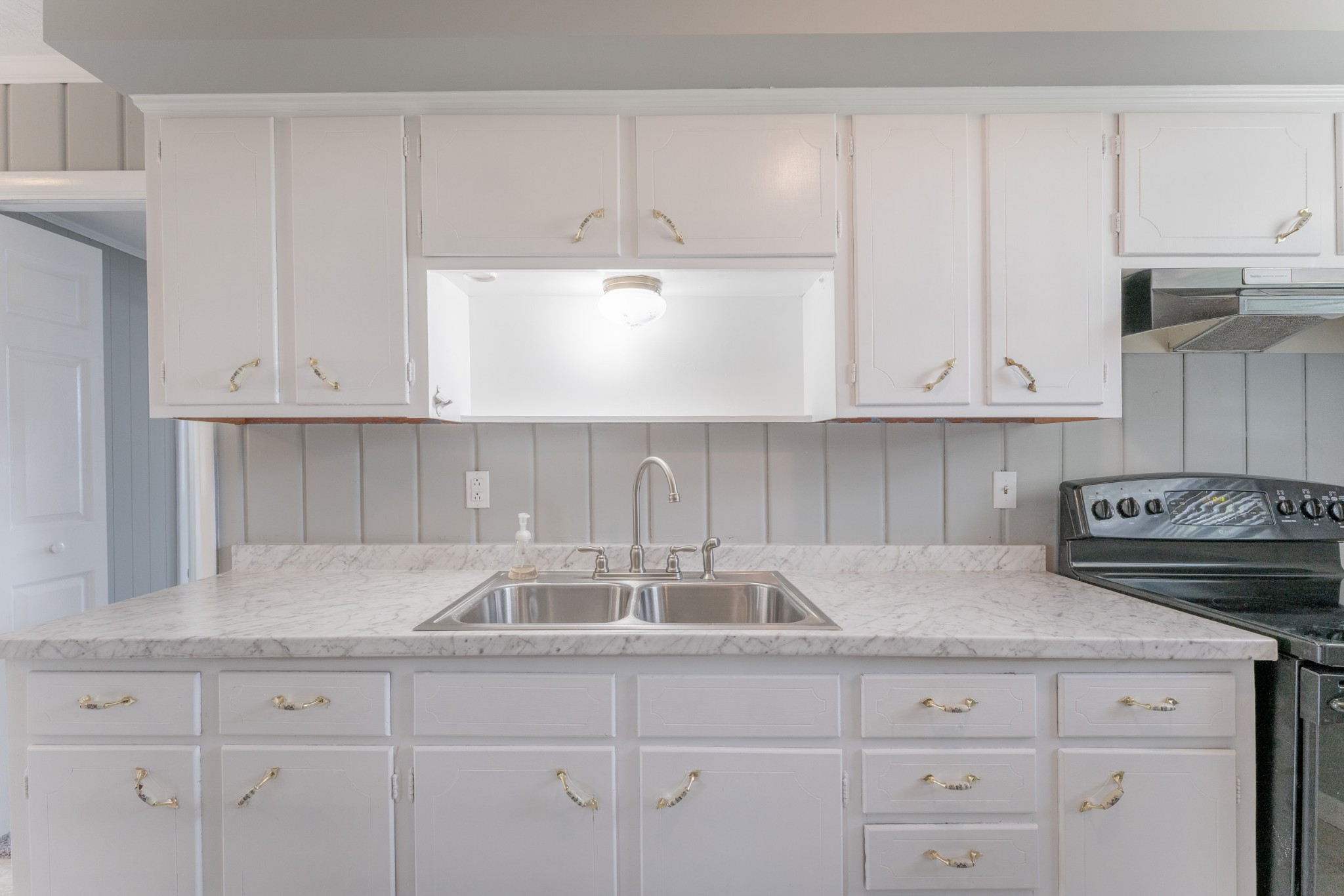 178 Jacksonian Drive Hermitage, TN 37076 - Photo 12 of 38 a kitchen with white cabinets and a sink