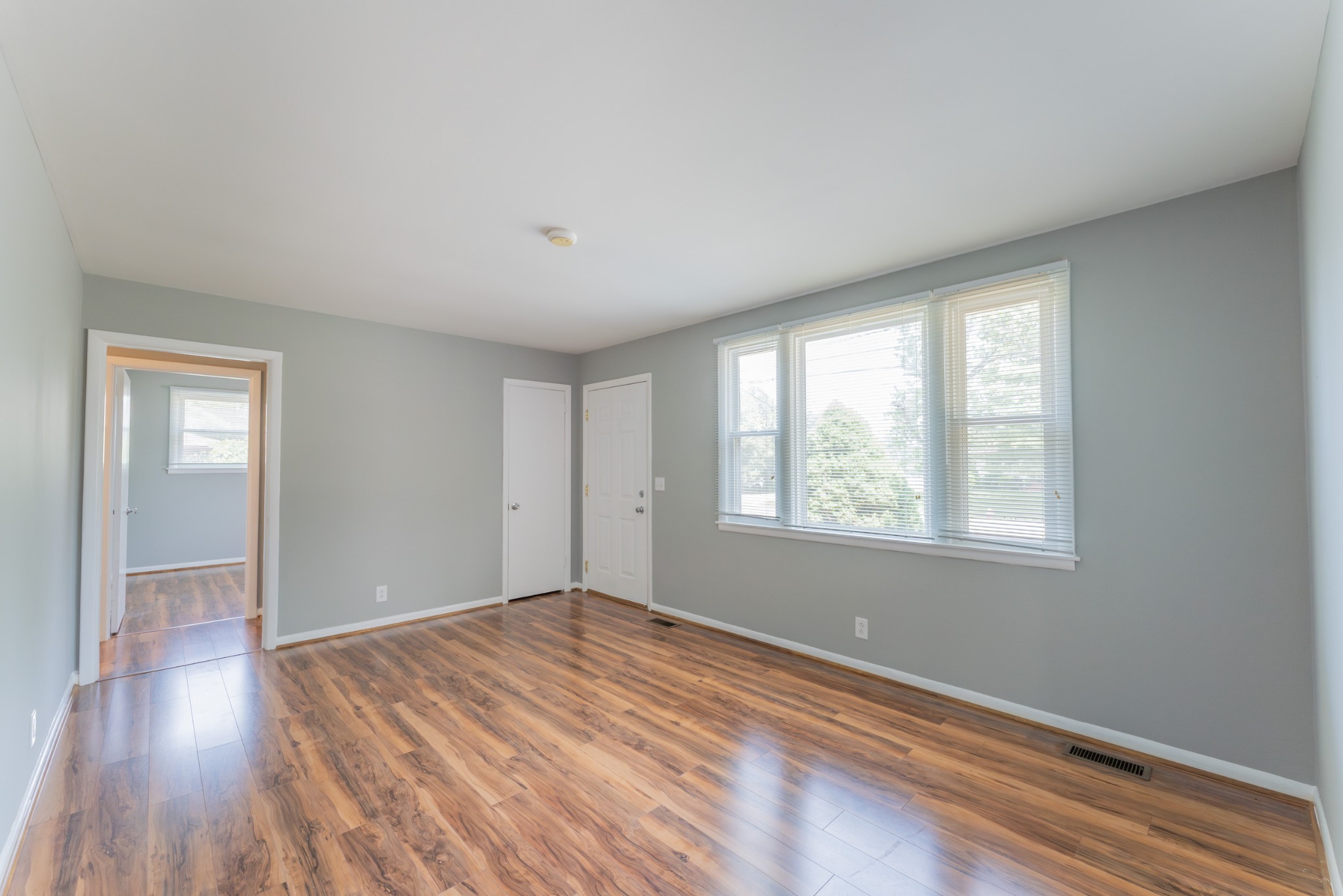 178 Jacksonian Drive Hermitage, TN 37076 - Photo 8 of 38 a view of an empty room with wooden floor and a window