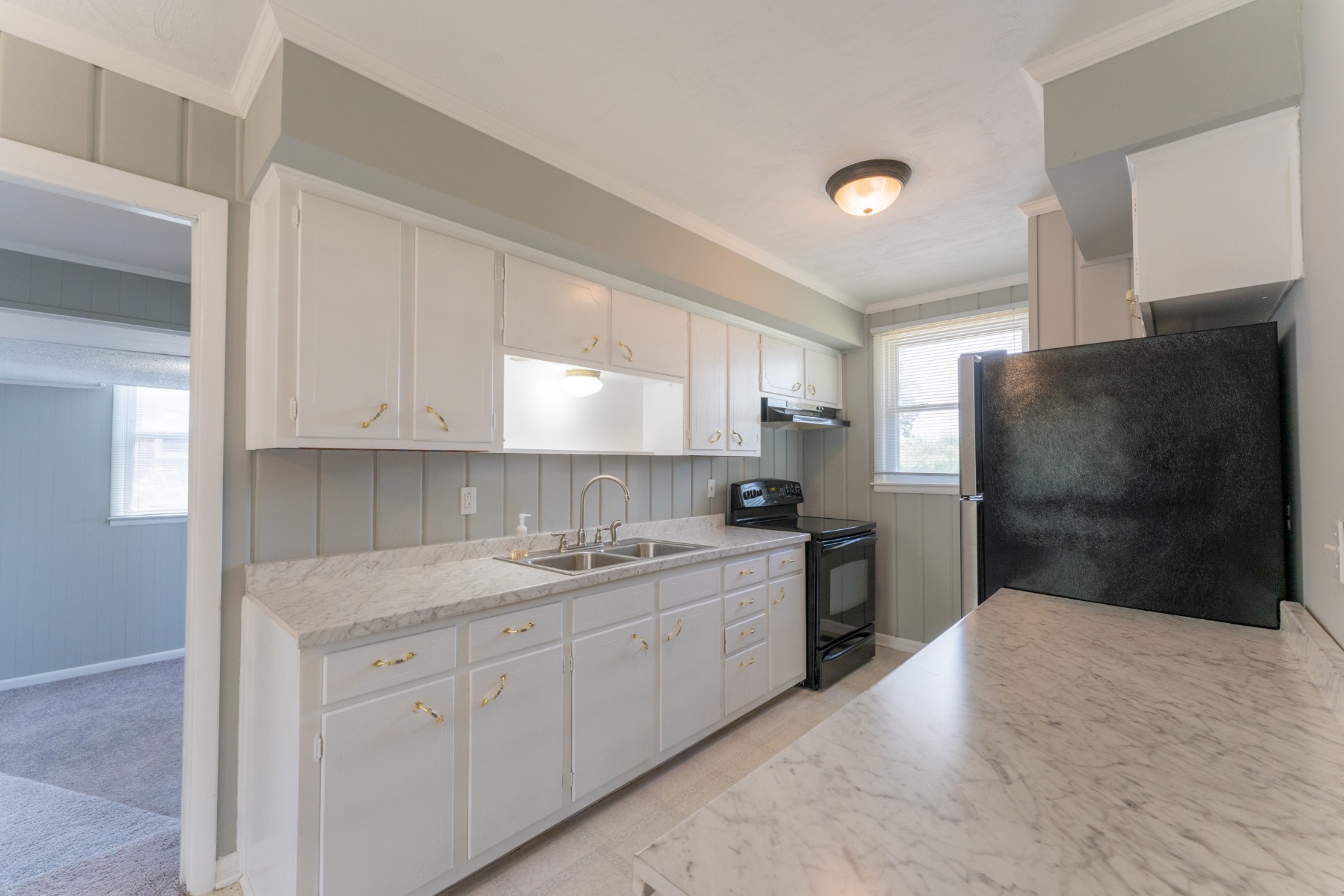 178 Jacksonian Drive Hermitage, TN 37076 - Photo 9 of 38 a kitchen with a sink dishwasher a refrigerator and cabinets