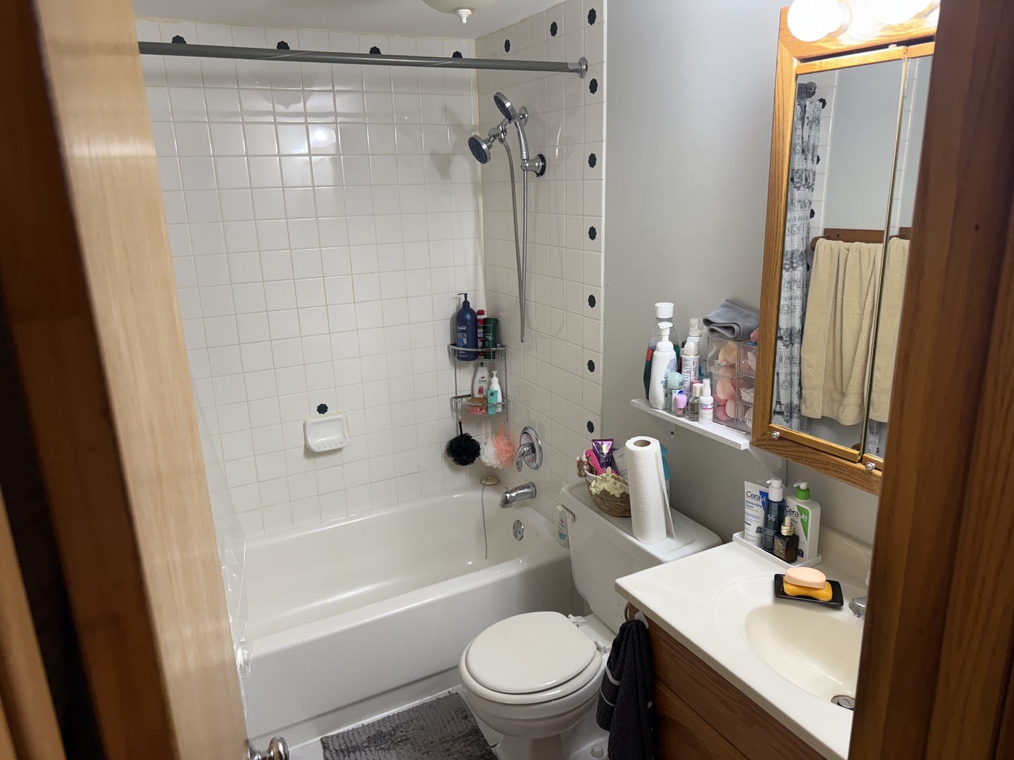 1460 Fairlane Drive, Unit 228 Schaumburg, IL 60193 - Photo 15 of 22 a bathroom with a sink a toilet and shower