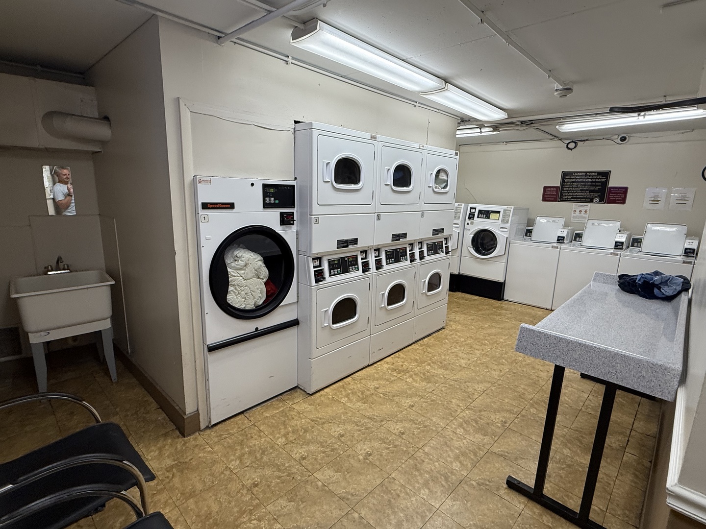 1460 Fairlane Drive, Unit 228 Schaumburg, IL 60193 - Photo 16 of 22 a utility room with dryer washer and a view of living room