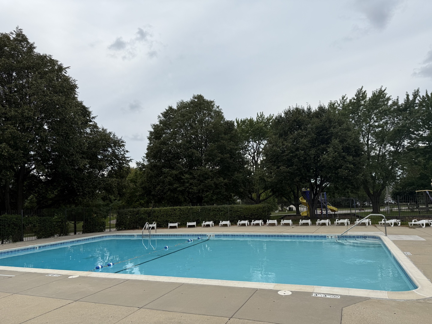 1460 Fairlane Drive, Unit 228 Schaumburg, IL 60193 - Photo 20 of 22 a view of swimming pool with outdoor seating and green space