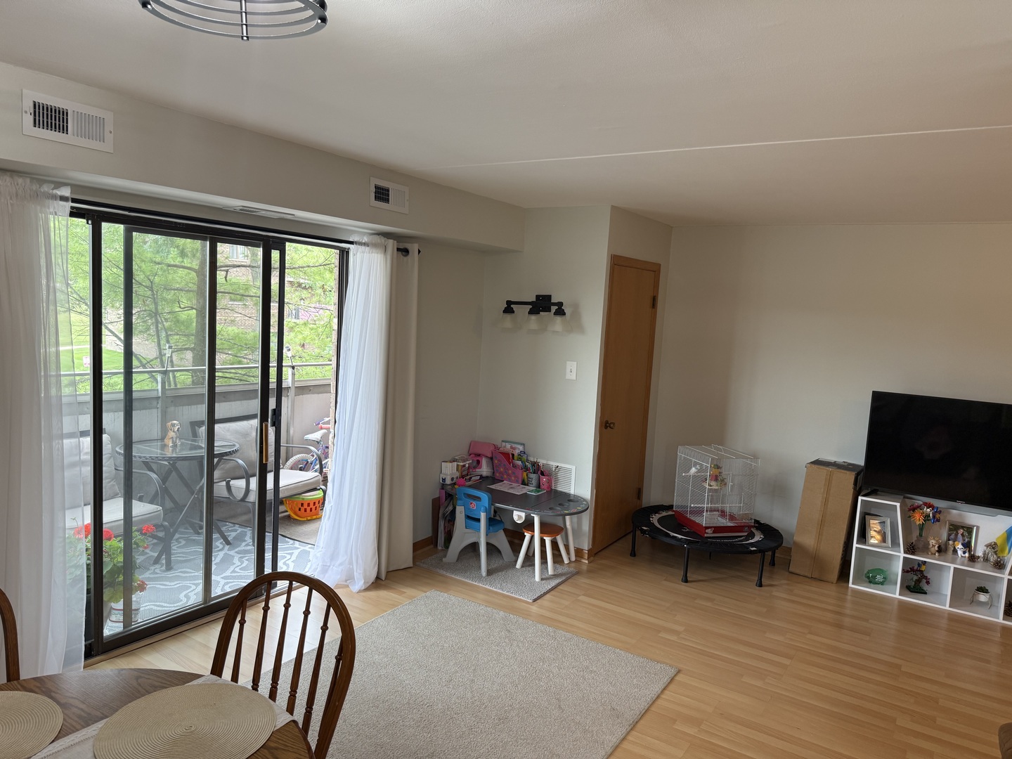 1460 Fairlane Drive, Unit 228 Schaumburg, IL 60193 - Photo 5 of 22 a living room with furniture and a flat screen tv